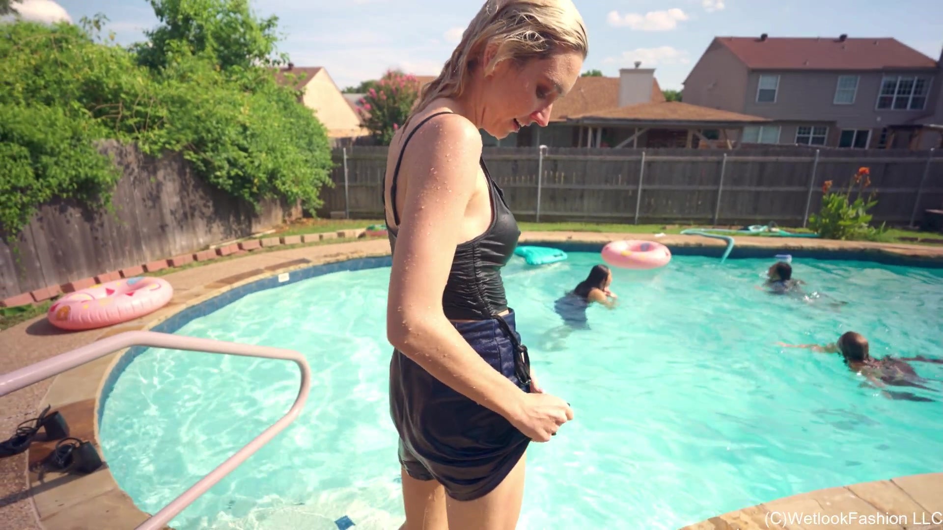 4 Girls Are Having Fun in the Pool Fully Clothed