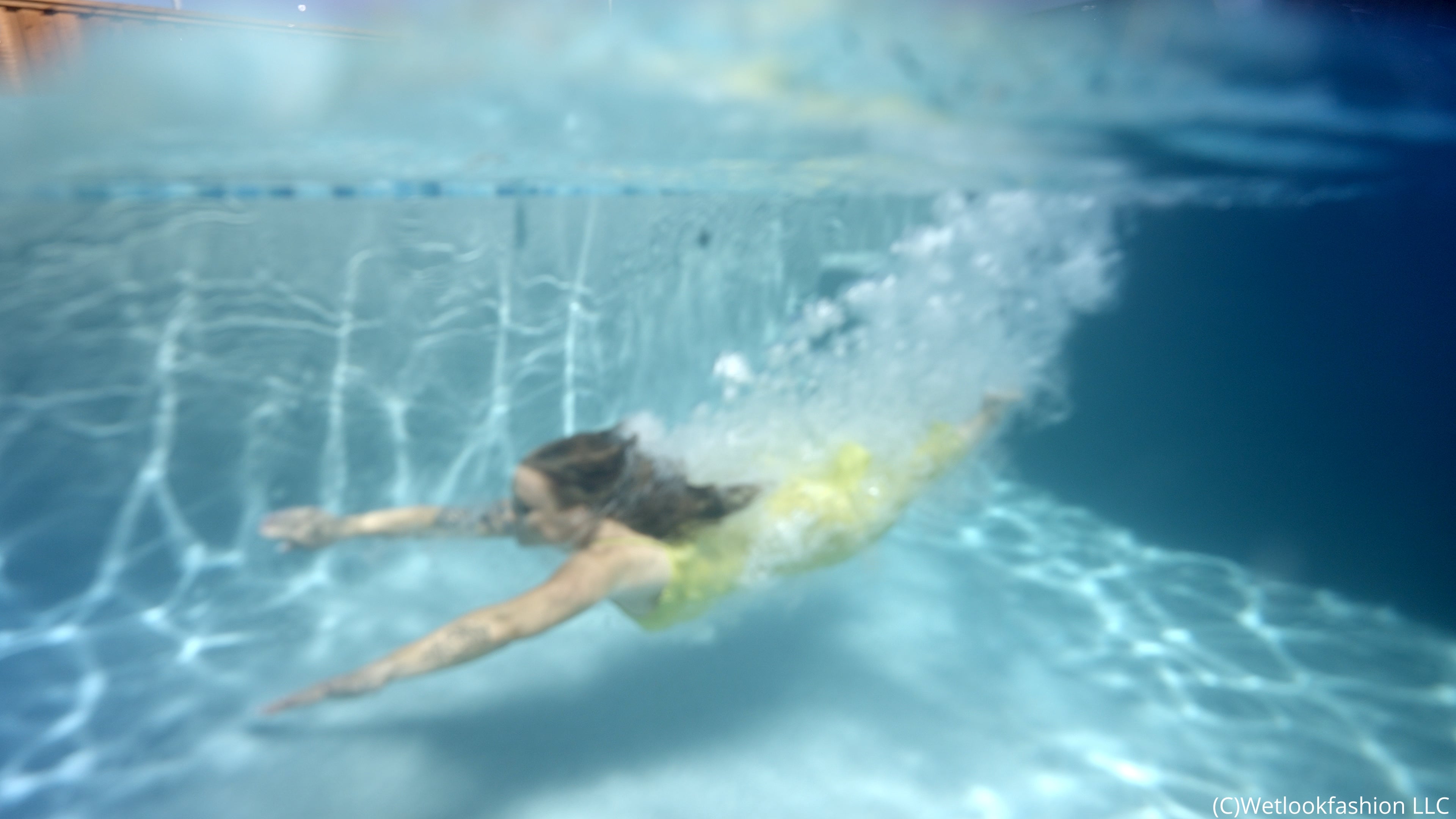 Presley takes a Swim in a Yellow Satin Dress