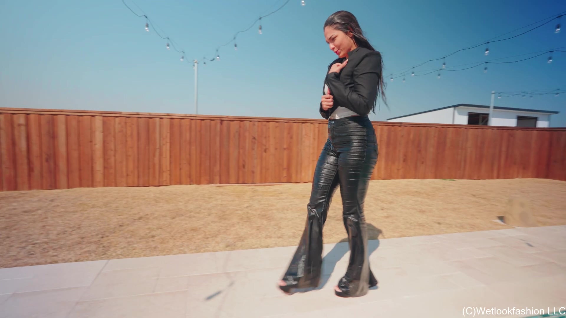 Alexandra Enjoys the Pool Wearing a Black Pant Suit