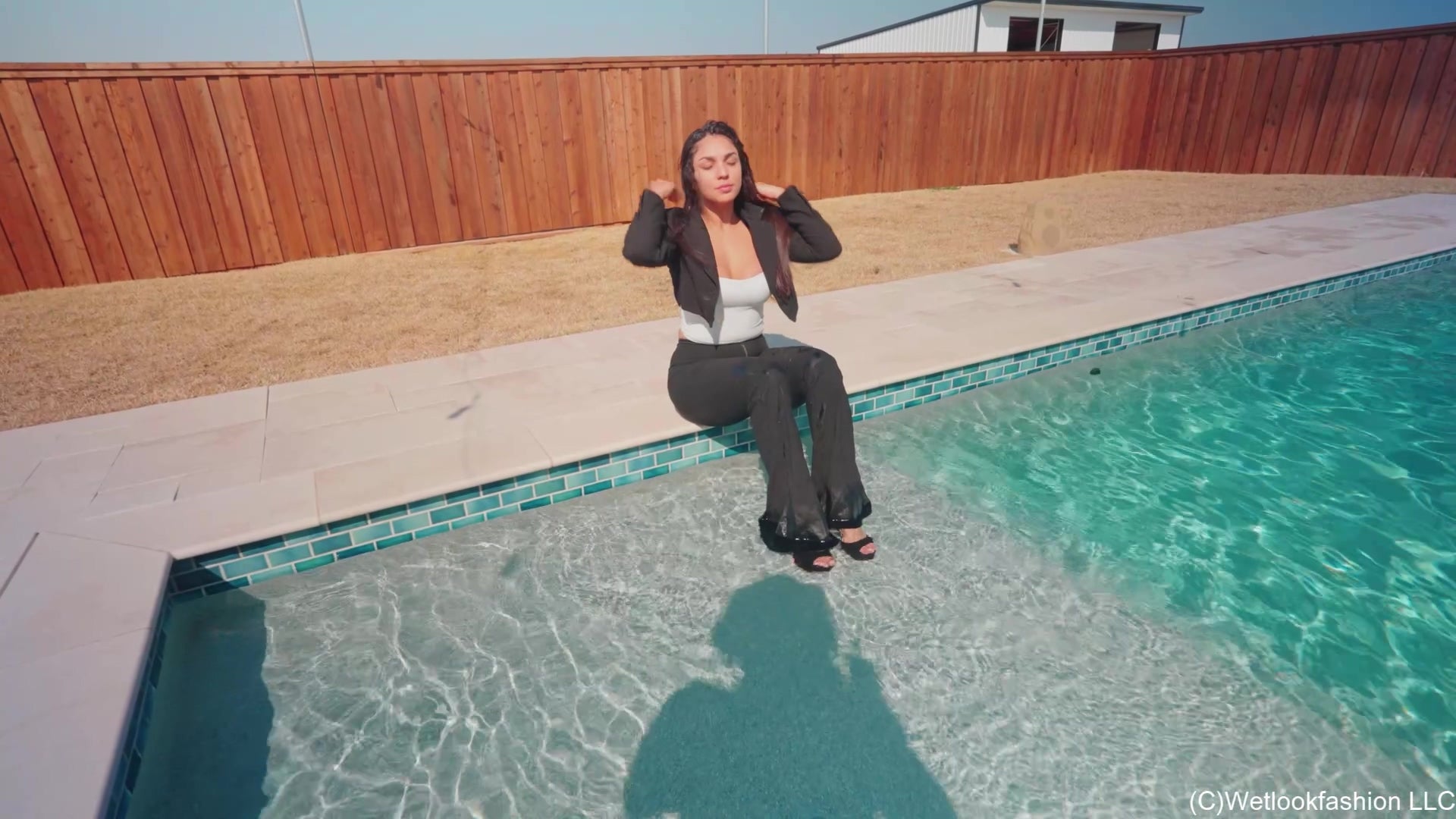 Alexandra Enjoys the Pool Wearing a Black Pant Suit