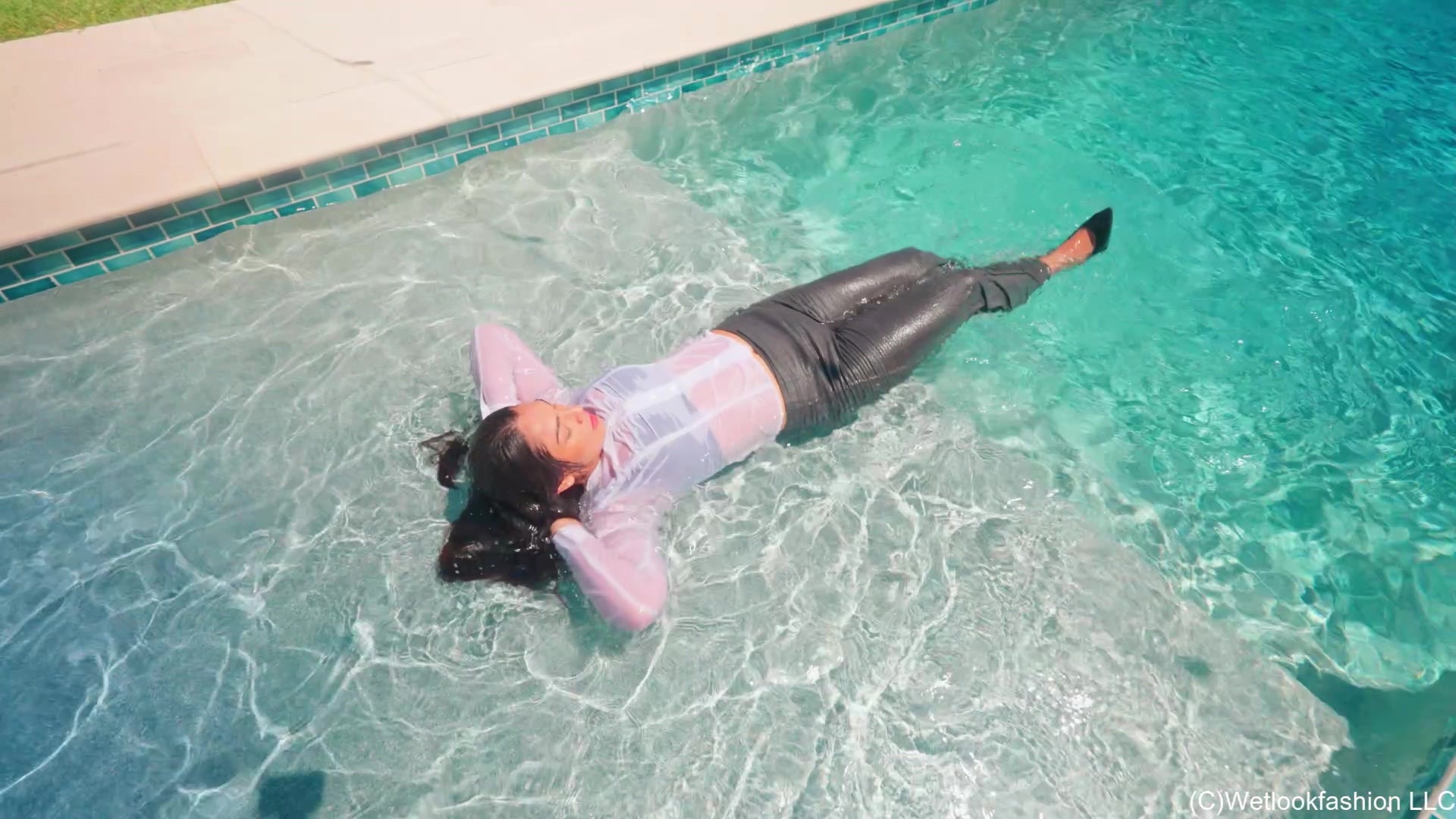 Alexandra Swims in a White and Grey Business Outfit