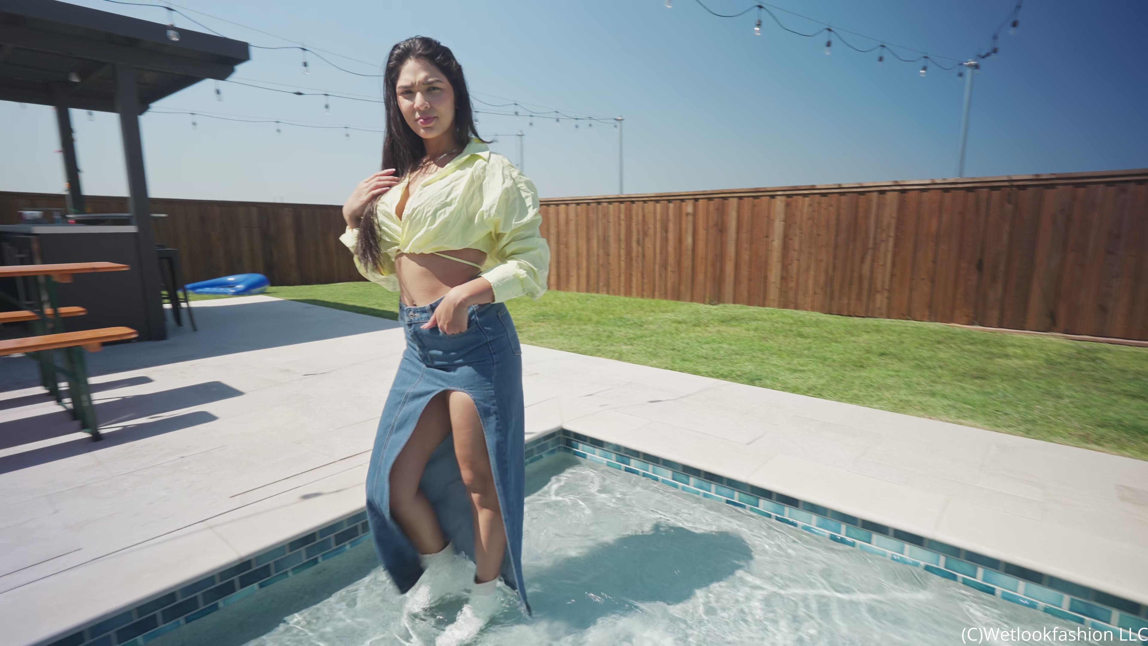 Alexandra Takes a Dip Wearing a Jean Skirt, Top and Boots