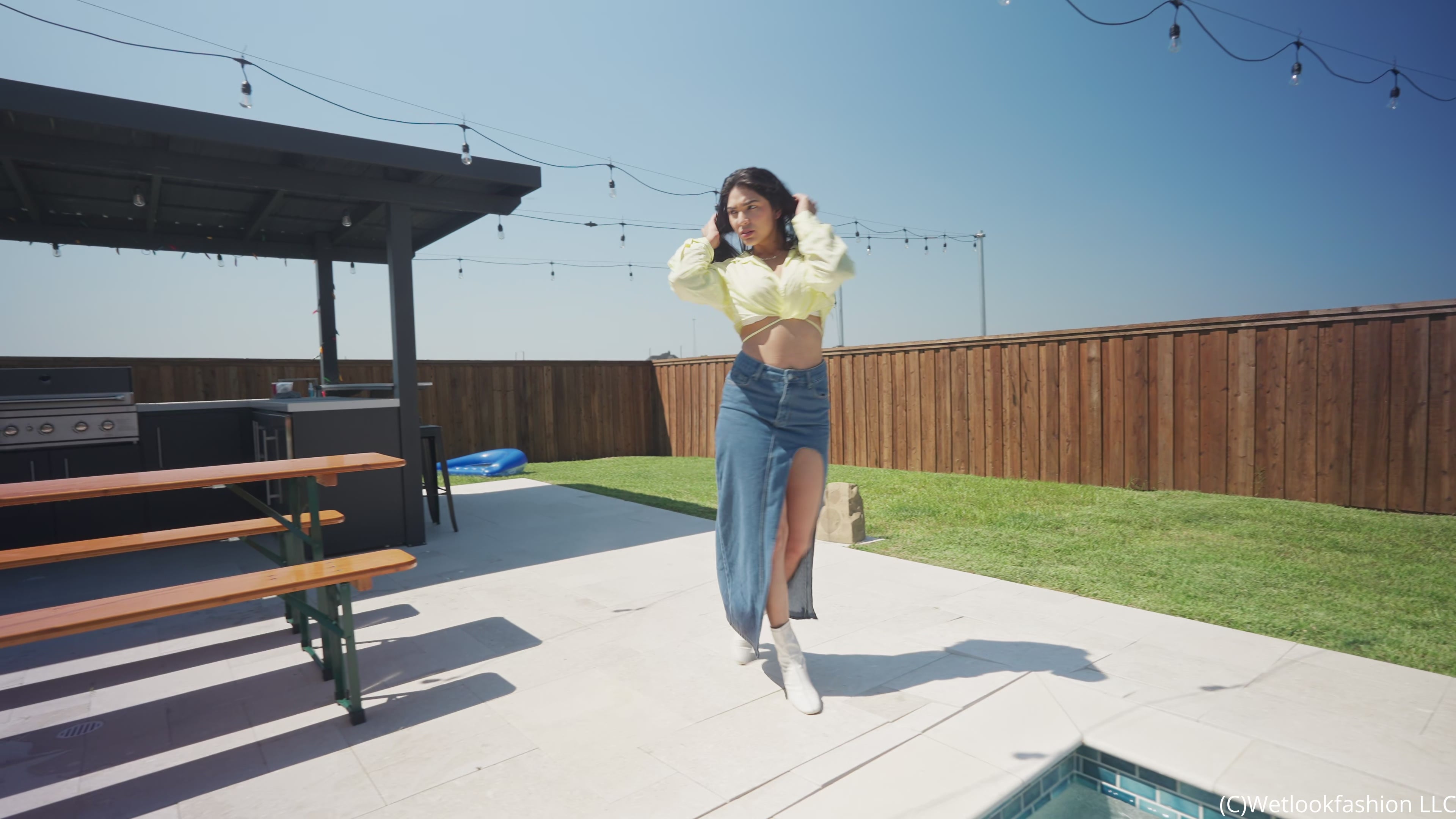 Alexandra Takes a Dip Wearing a Jean Skirt, Top and Boots