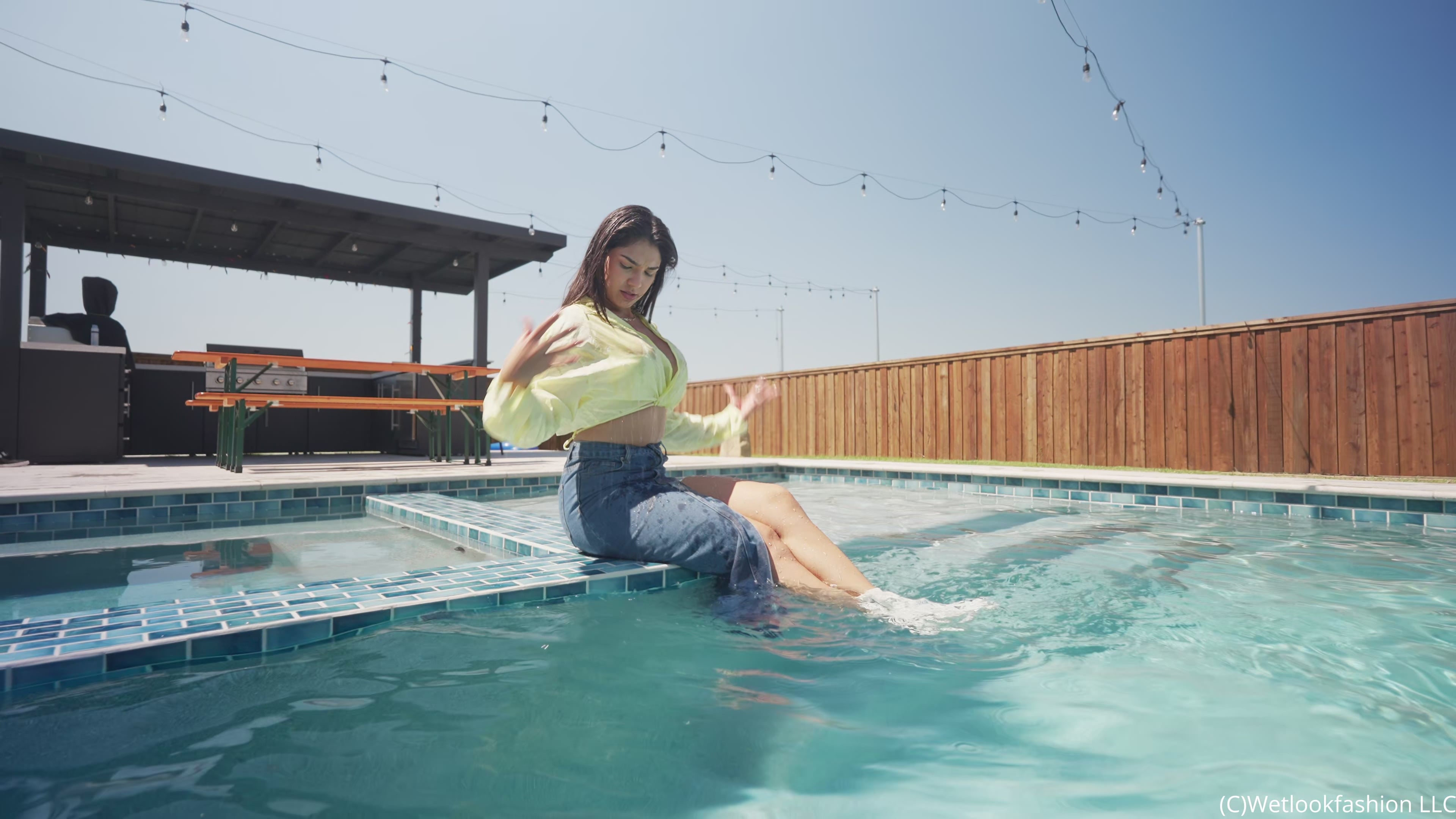 Alexandra Takes a Dip Wearing a Jean Skirt, Top and Boots