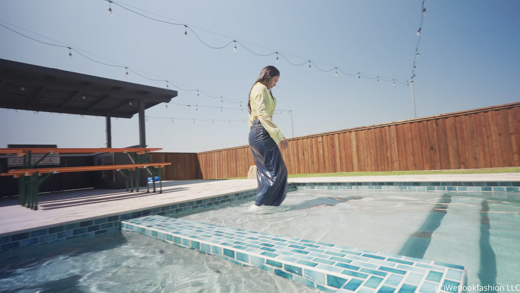 Alexandra Takes a Dip Wearing a Jean Skirt, Top and Boots