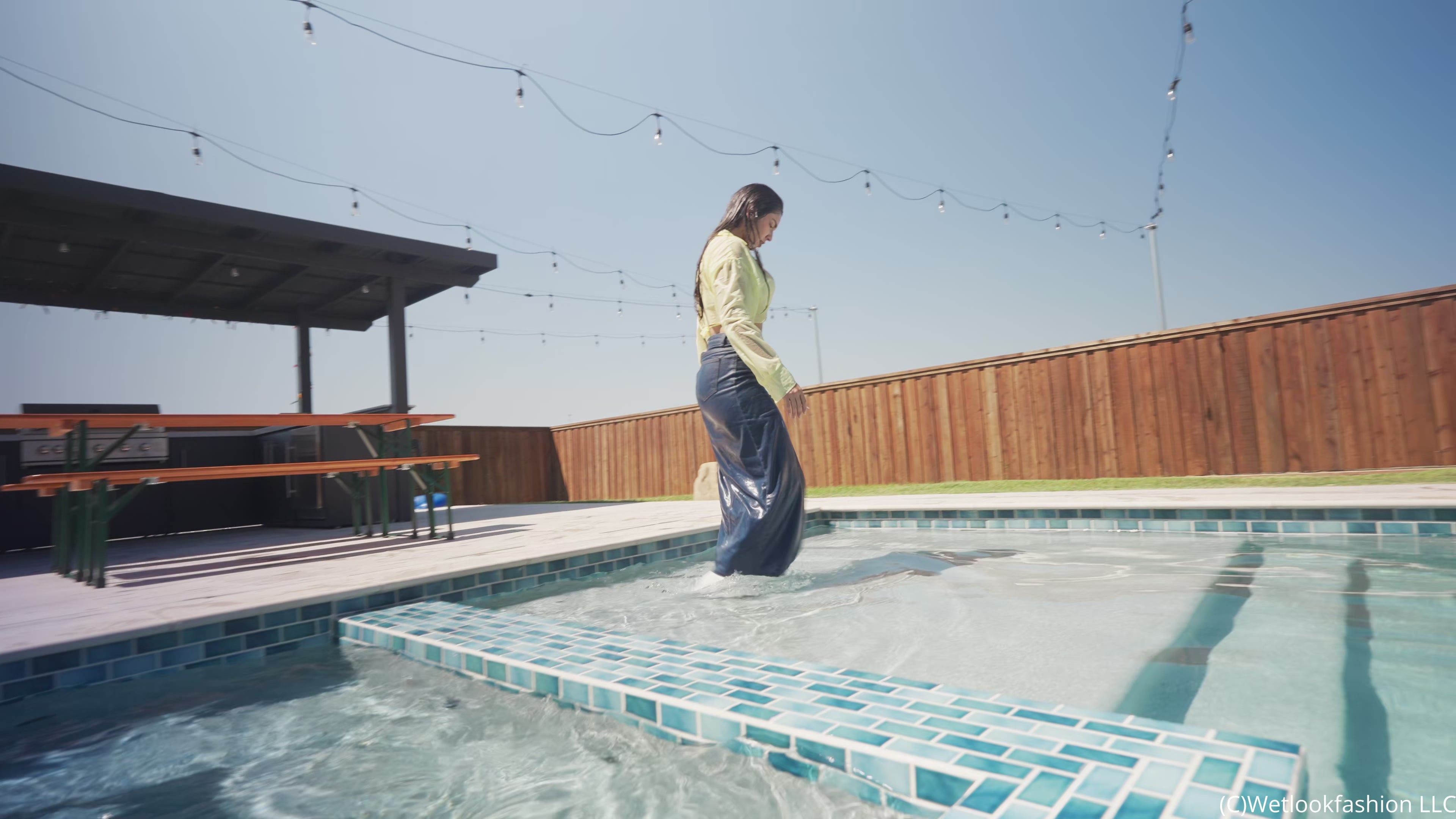 Alexandra Takes a Dip Wearing a Jean Skirt, Top and Boots