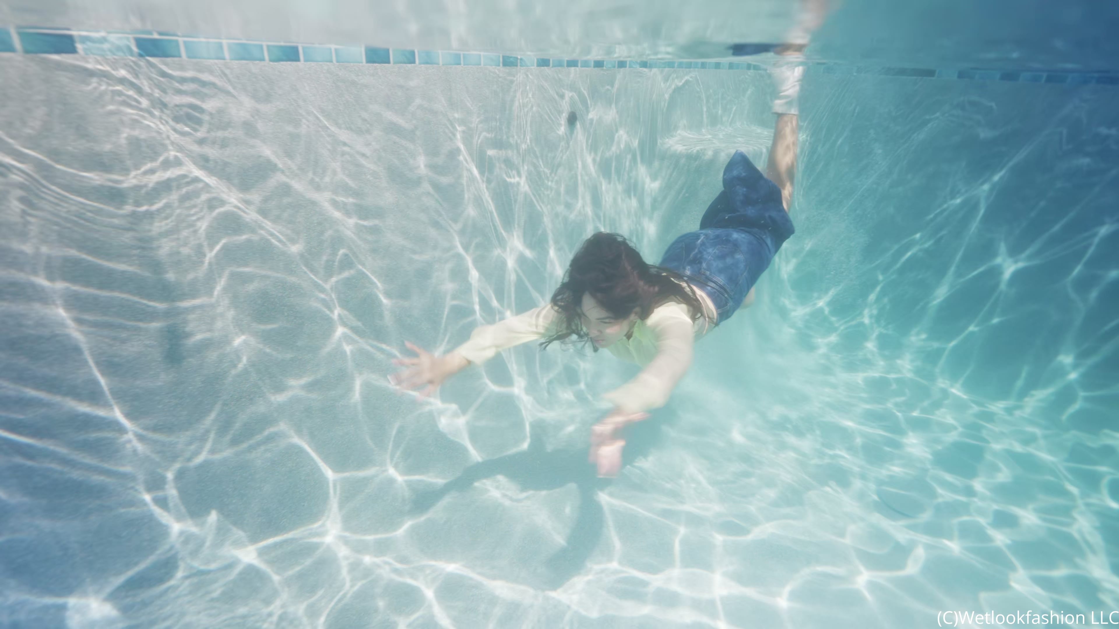 Alexandra Takes a Dip Wearing a Jean Skirt, Top and Boots
