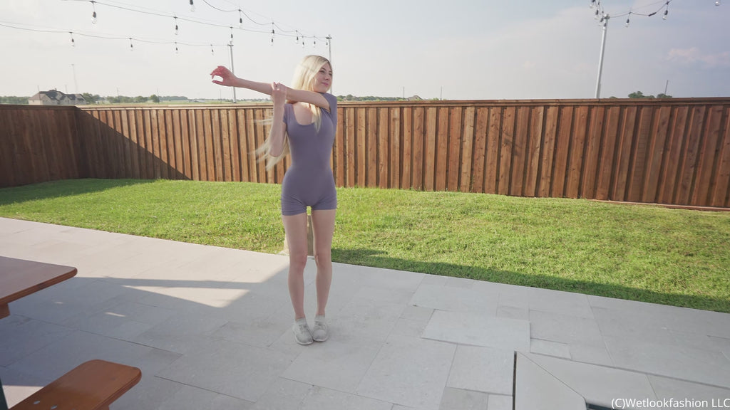 Amber Gets Wet in a Sporty Jumpsuit and Sneakers