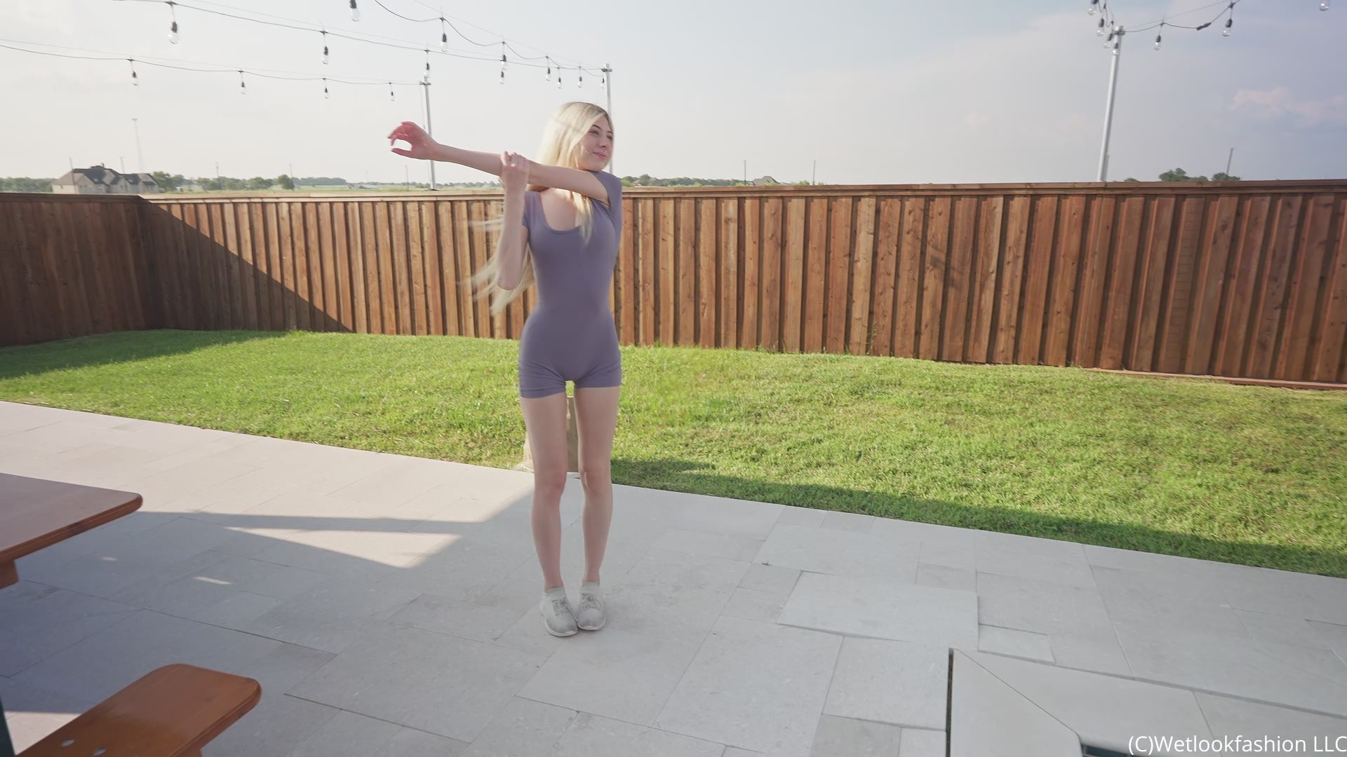 Amber Gets Wet in a Sporty Jumpsuit and Sneakers
