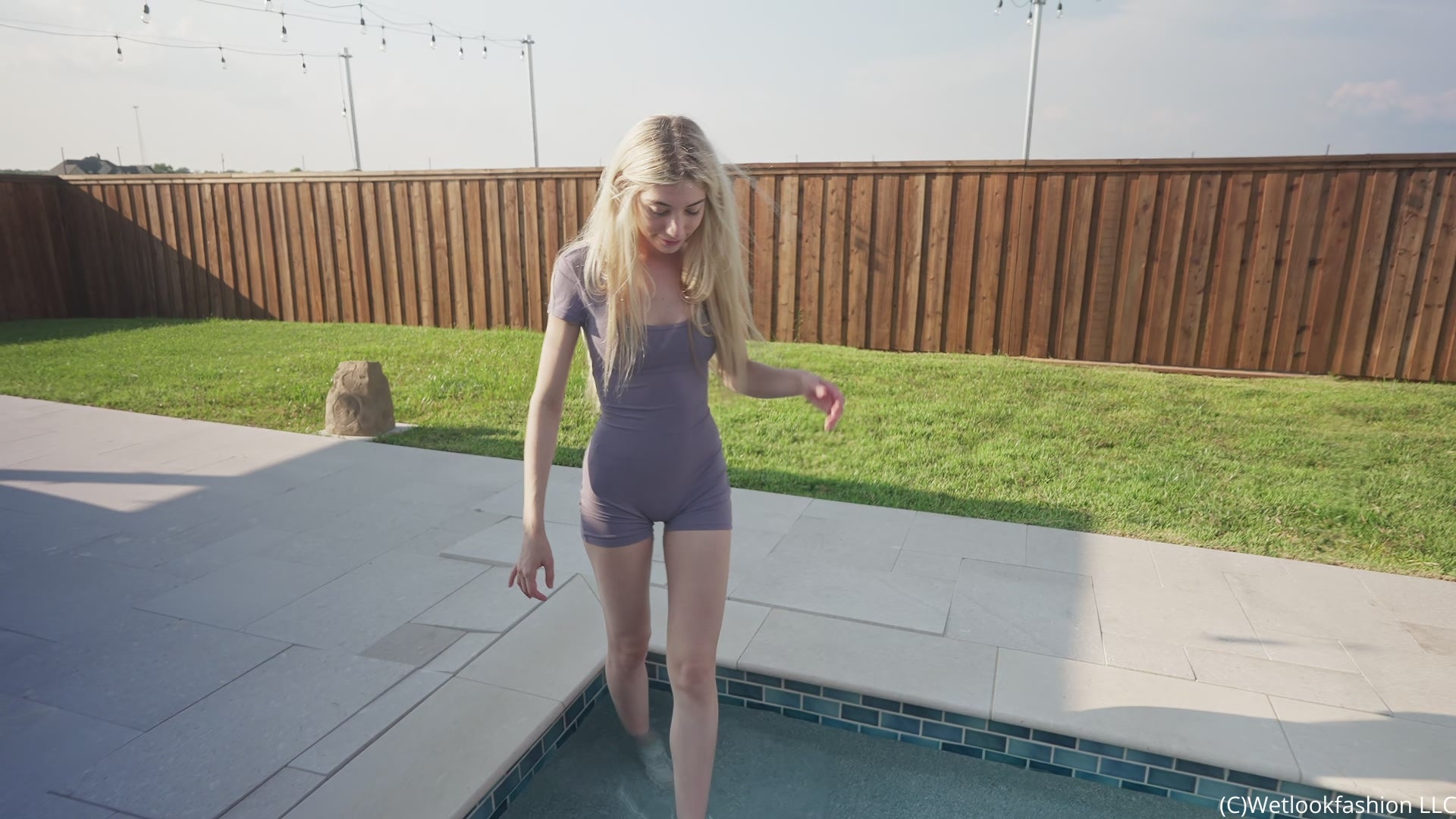 Amber Gets Wet in a Sporty Jumpsuit and Sneakers