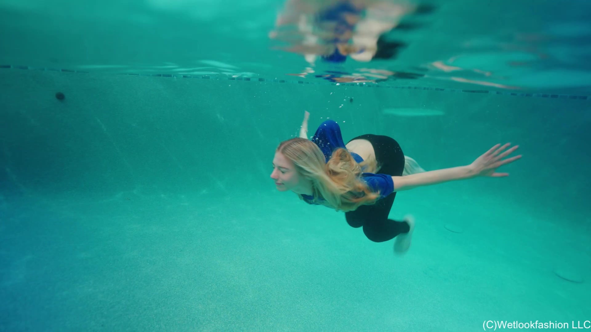 Amber Goes for a Swim in Leggings, T-Shirt and Sneakers