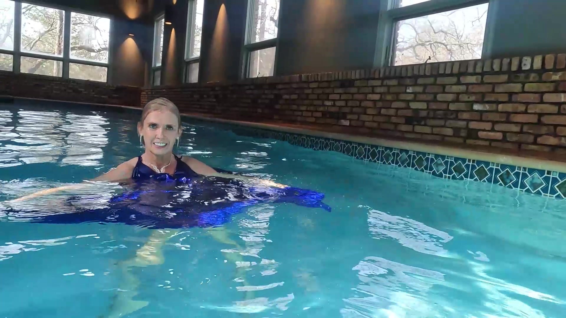 Angel Swims In Her Stunning Blue Evening Gown