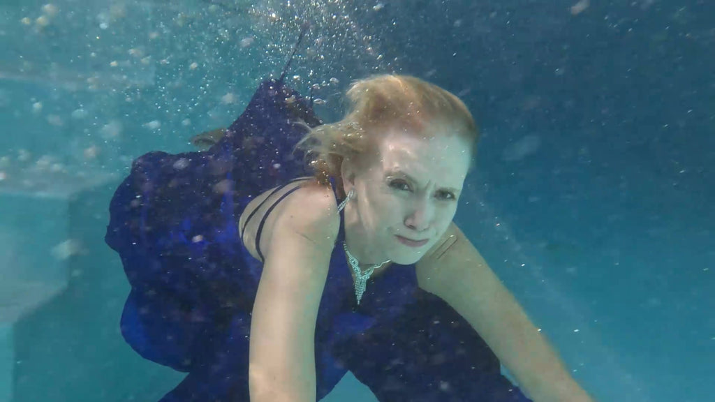 Angel Swims In Her Stunning Blue Evening Gown
