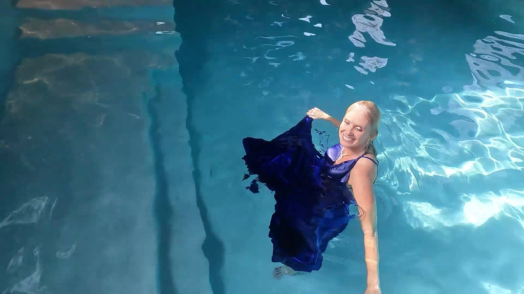 Angel Swims In Her Stunning Blue Evening Gown