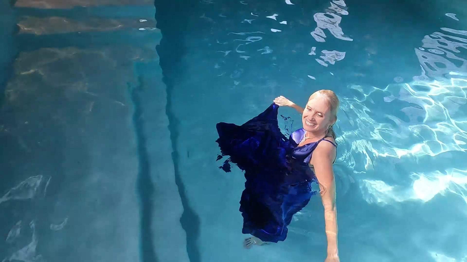 Angel Swims In Her Stunning Blue Evening Gown