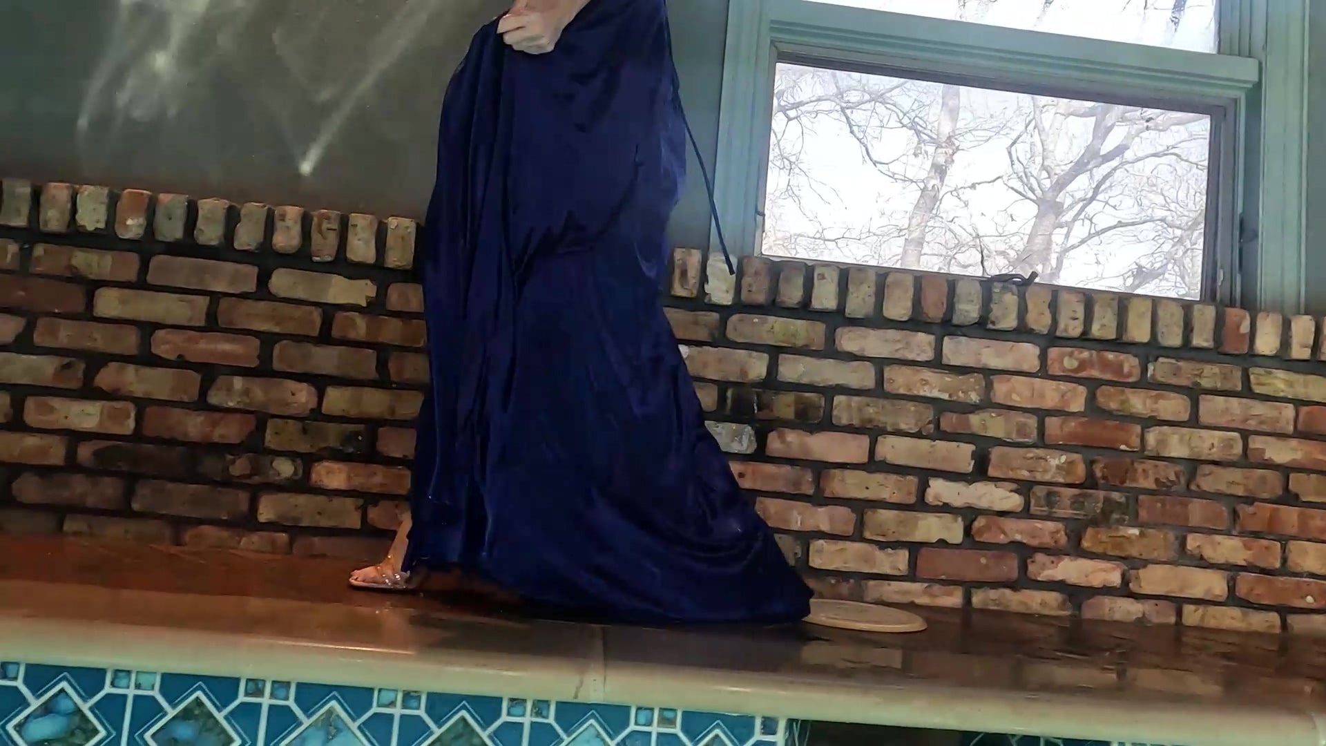 Angel Swims In Her Stunning Blue Evening Gown