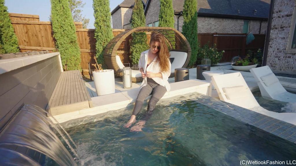 Rey Swims in Jeans, a Shirt and Barefoot