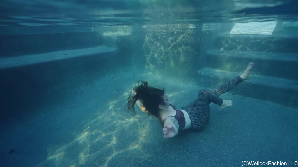 Rey Swims in Jeans, a Shirt and Barefoot