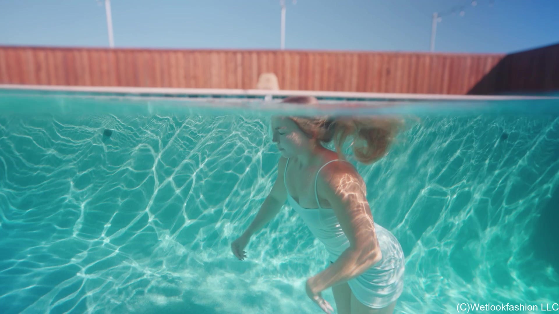 Brinley Swims in White