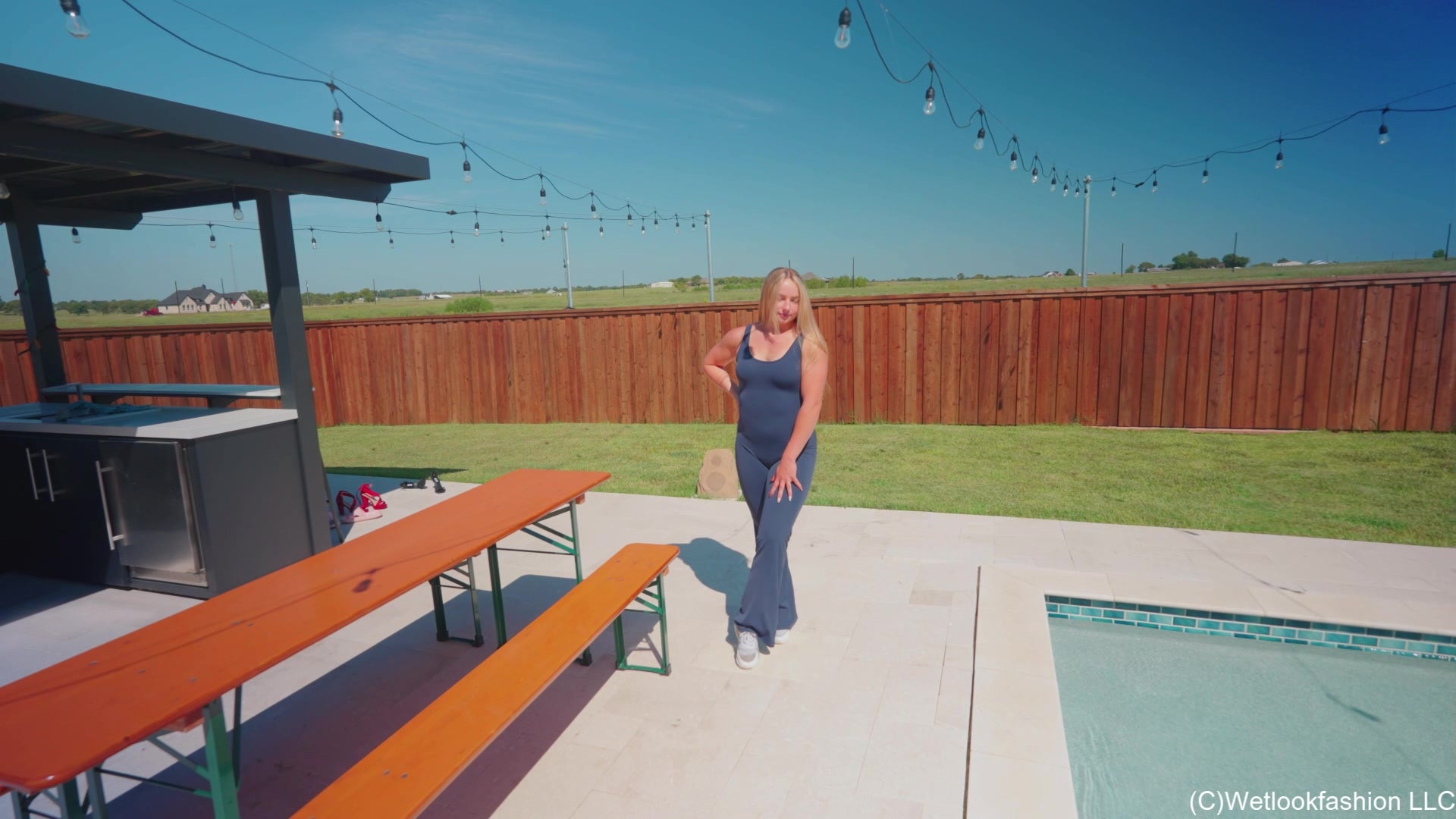 Brinley Swims in a Sporty Jumpsuit and Sneakers