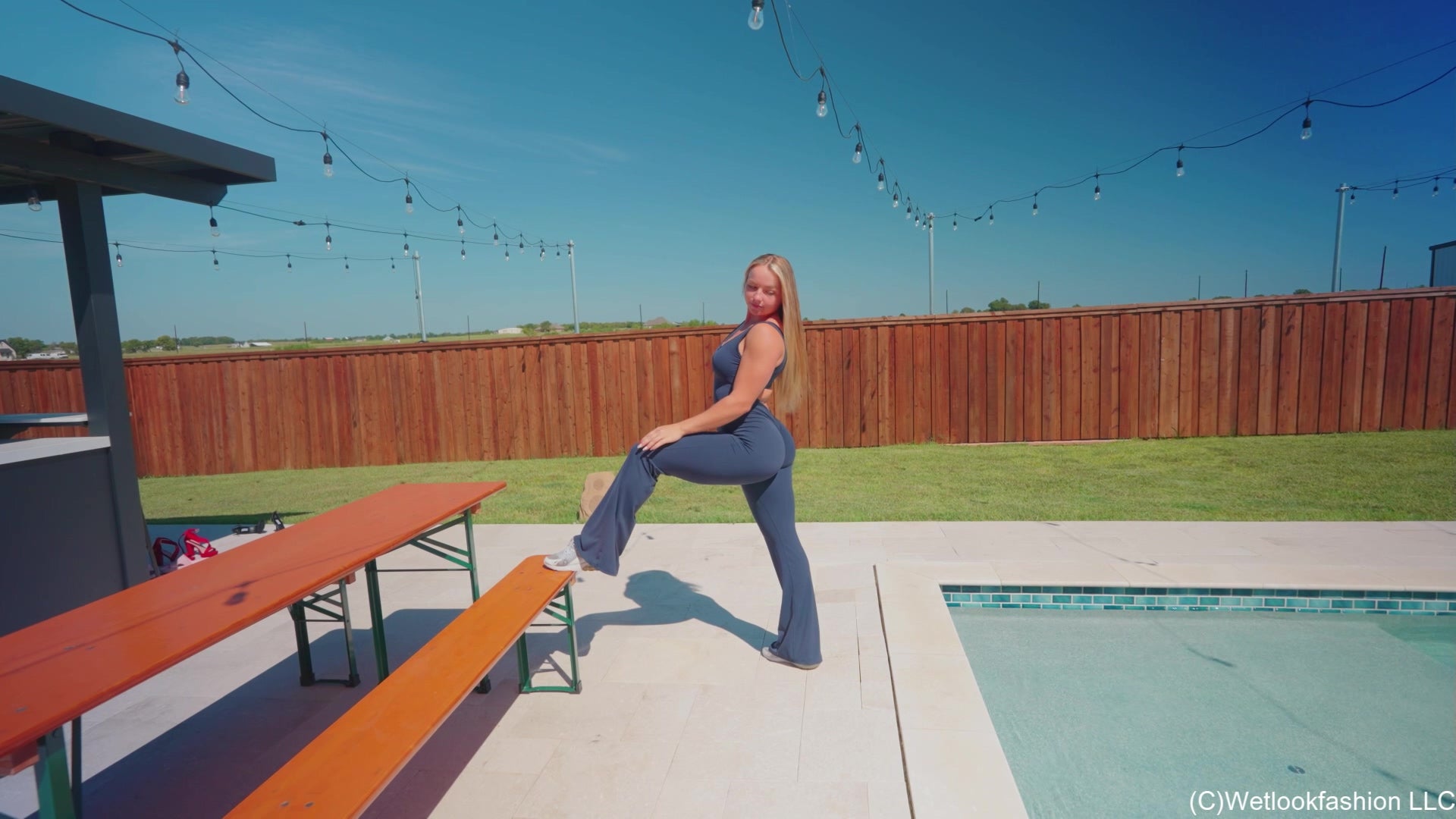 Brinley Swims in a Sporty Jumpsuit and Sneakers