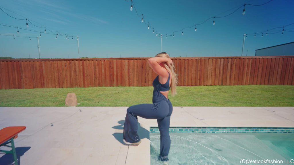Brinley Swims in a Sporty Jumpsuit and Sneakers