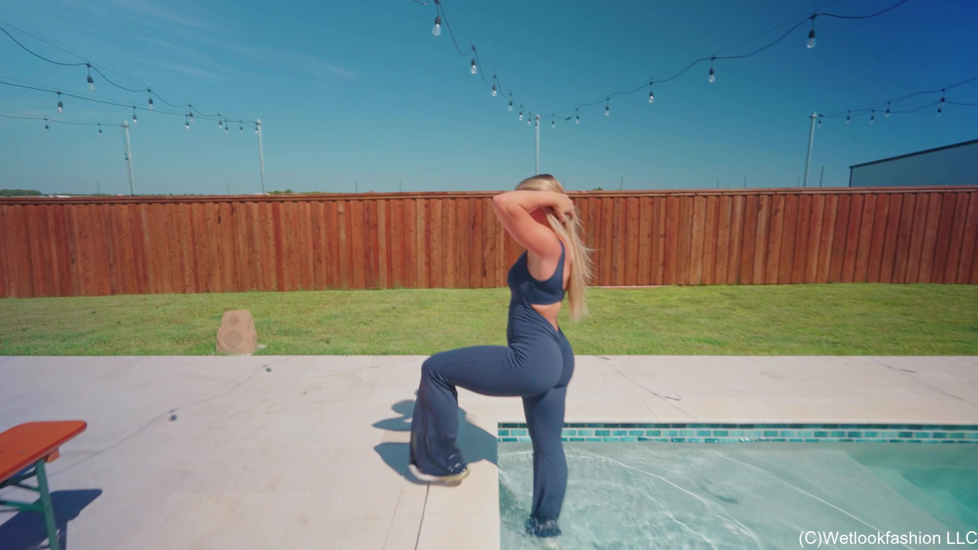 Brinley Swims in a Sporty Jumpsuit and Sneakers