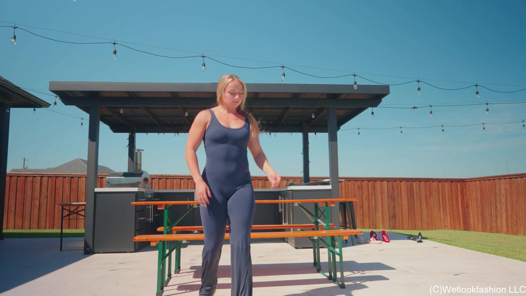Brinley Swims in a Sporty Jumpsuit and Sneakers