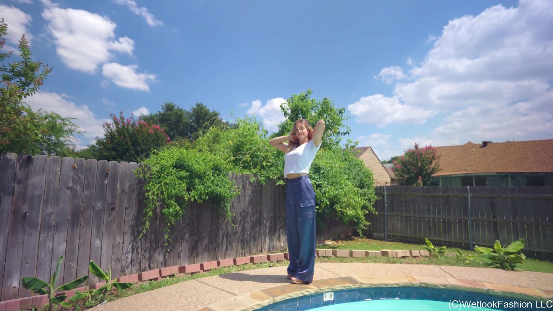 Camille Swims in a White Shirt and Blue Satin Pants