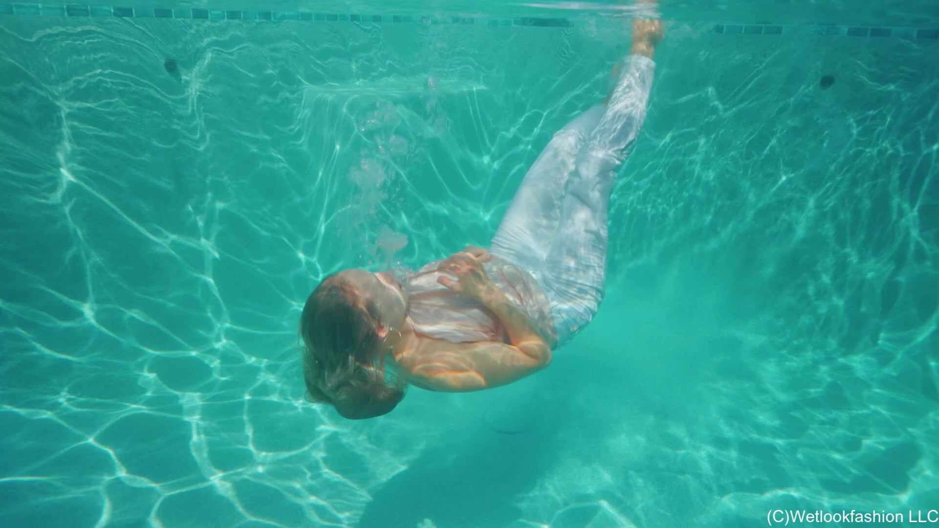 Camille Goes for a Swim in White Jeans and a Satin Top