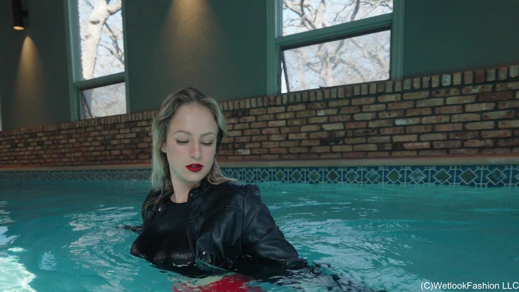 Camille in the Pool Wearing a Red and Black Leather Outfit