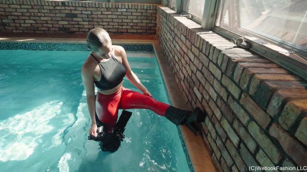Camille in the Pool Wearing a Red and Black Leather Outfit