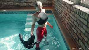 Camille in the Pool Wearing a Red and Black Leather Outfit