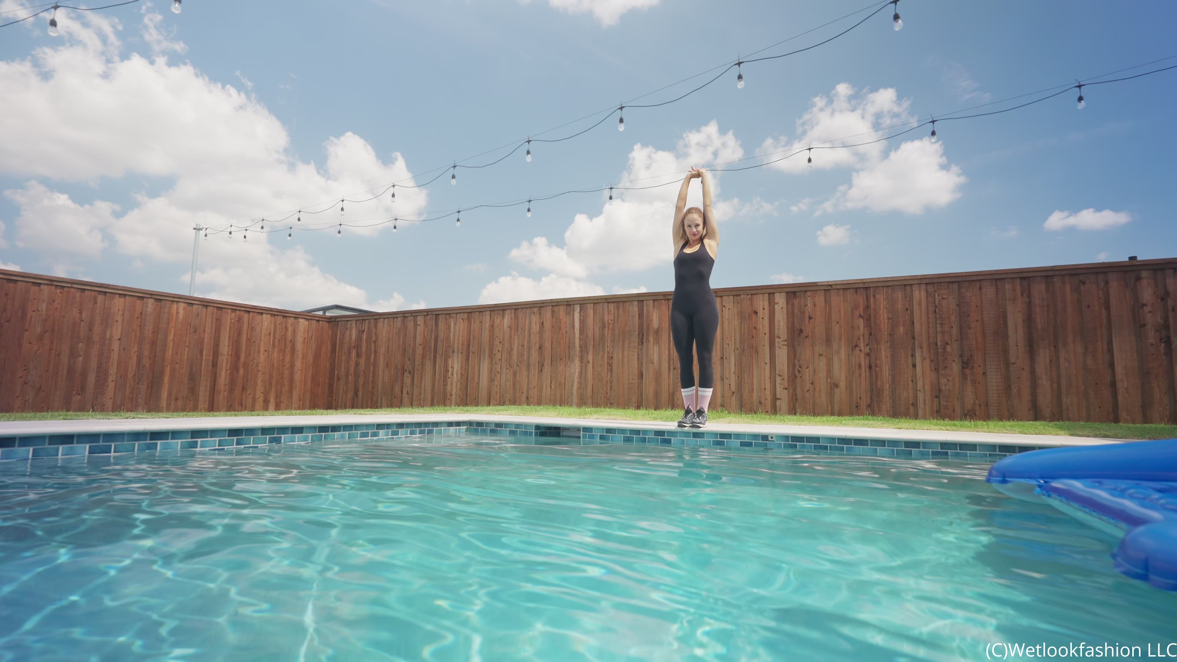Camille Split Dives in the Pool Wearing a Hot Jumpsuit