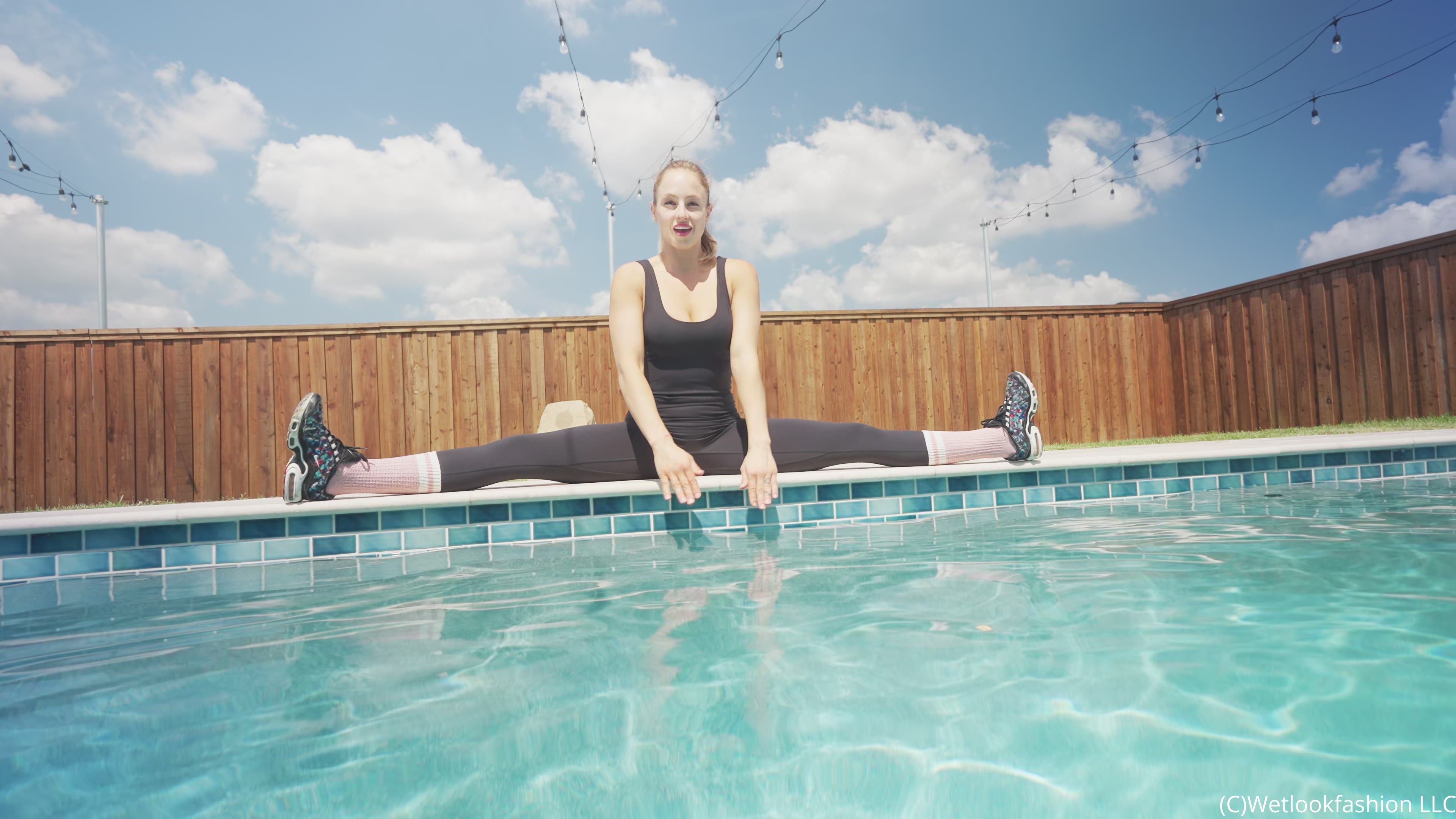 Camille Split Dives in the Pool Wearing a Hot Jumpsuit