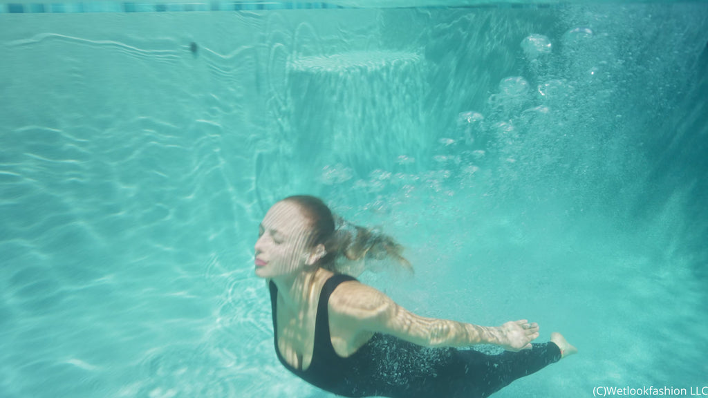 Camille Split Dives in the Pool Wearing a Hot Jumpsuit