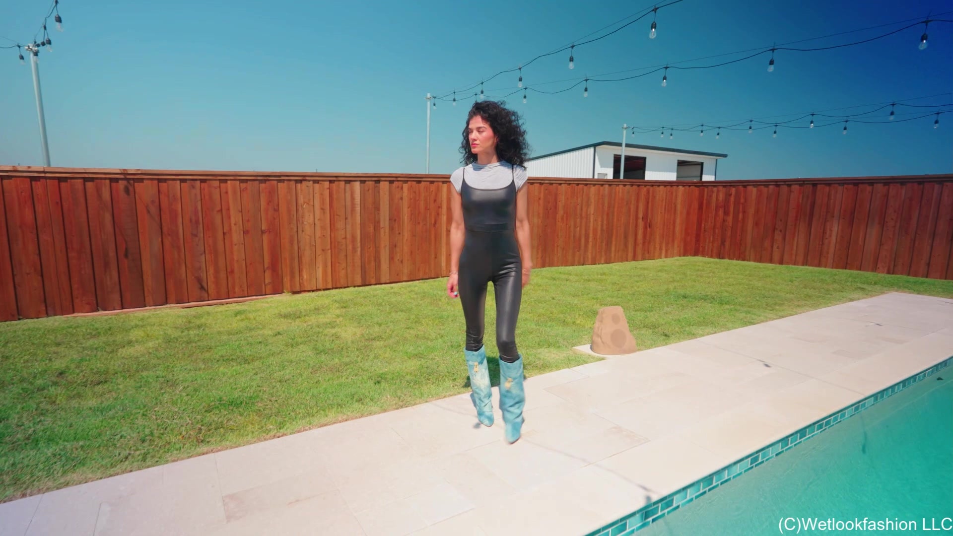 Carla Gets Wet in a Shiny Jumpsuit, Boots and a Shirt