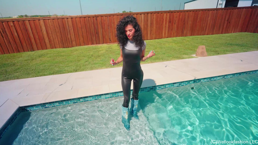 Carla Gets Wet in a Shiny Jumpsuit, Boots and a Shirt
