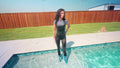 Carla Gets Wet in a Shiny Jumpsuit, Boots and a Shirt