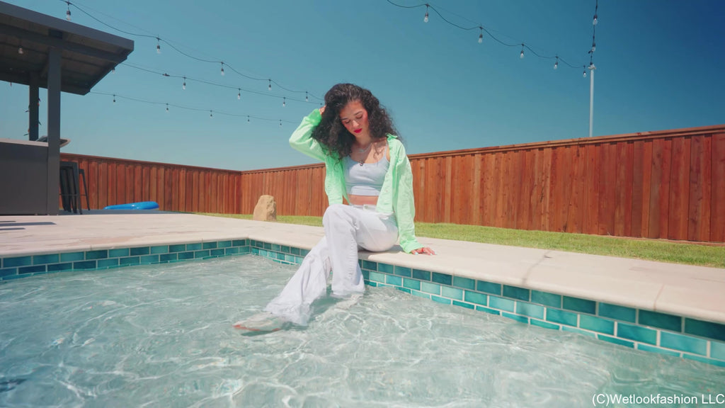 Carla Swims in White Jeans, Top and Shirt