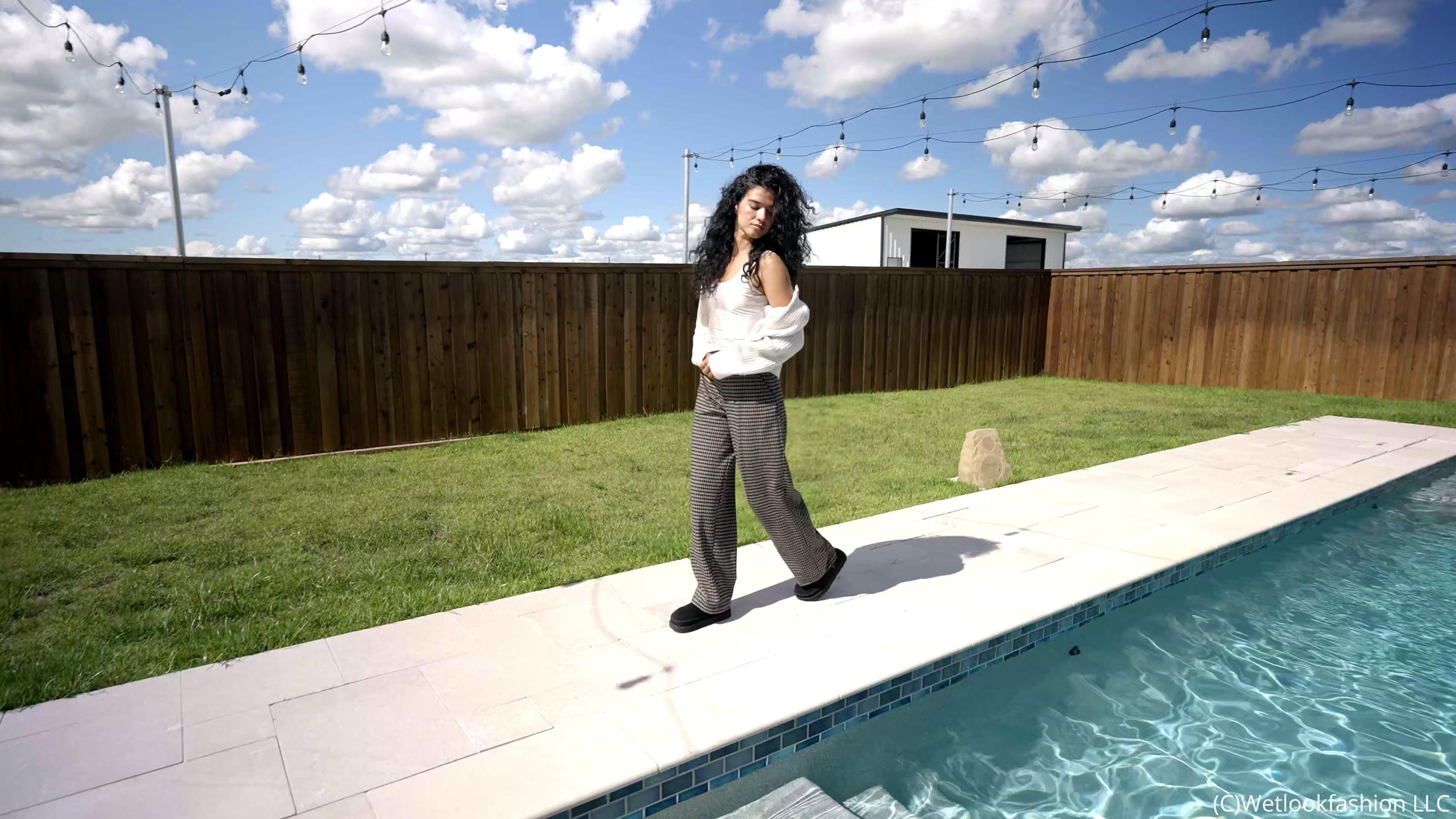 Carla Takes a Dip in the Pool Wearing a Casual Outfit