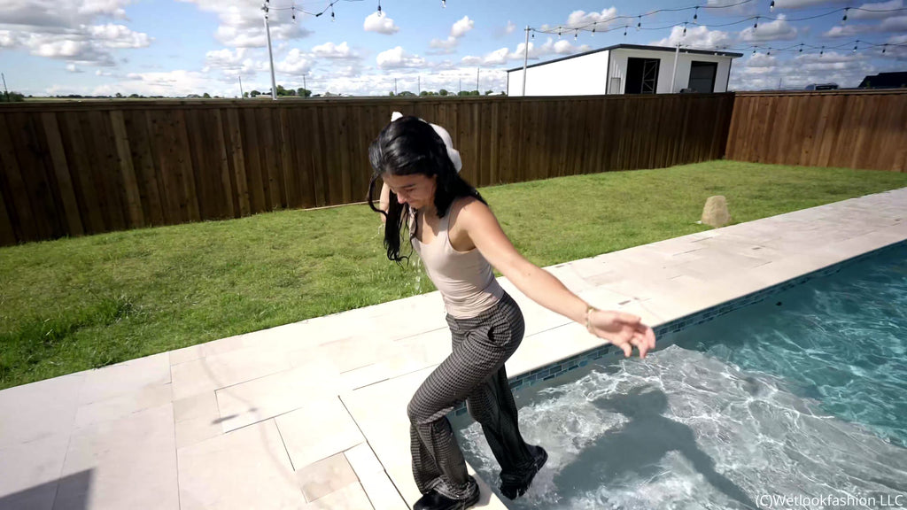 Carla Takes a Dip in the Pool Wearing a Casual Outfit