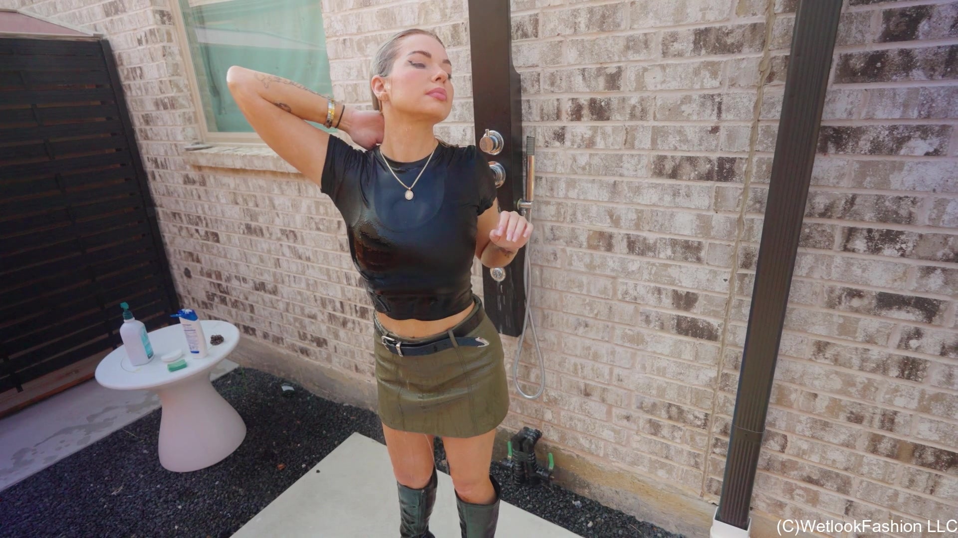 Casey Swims in a Leather Skirt, Top and Boots