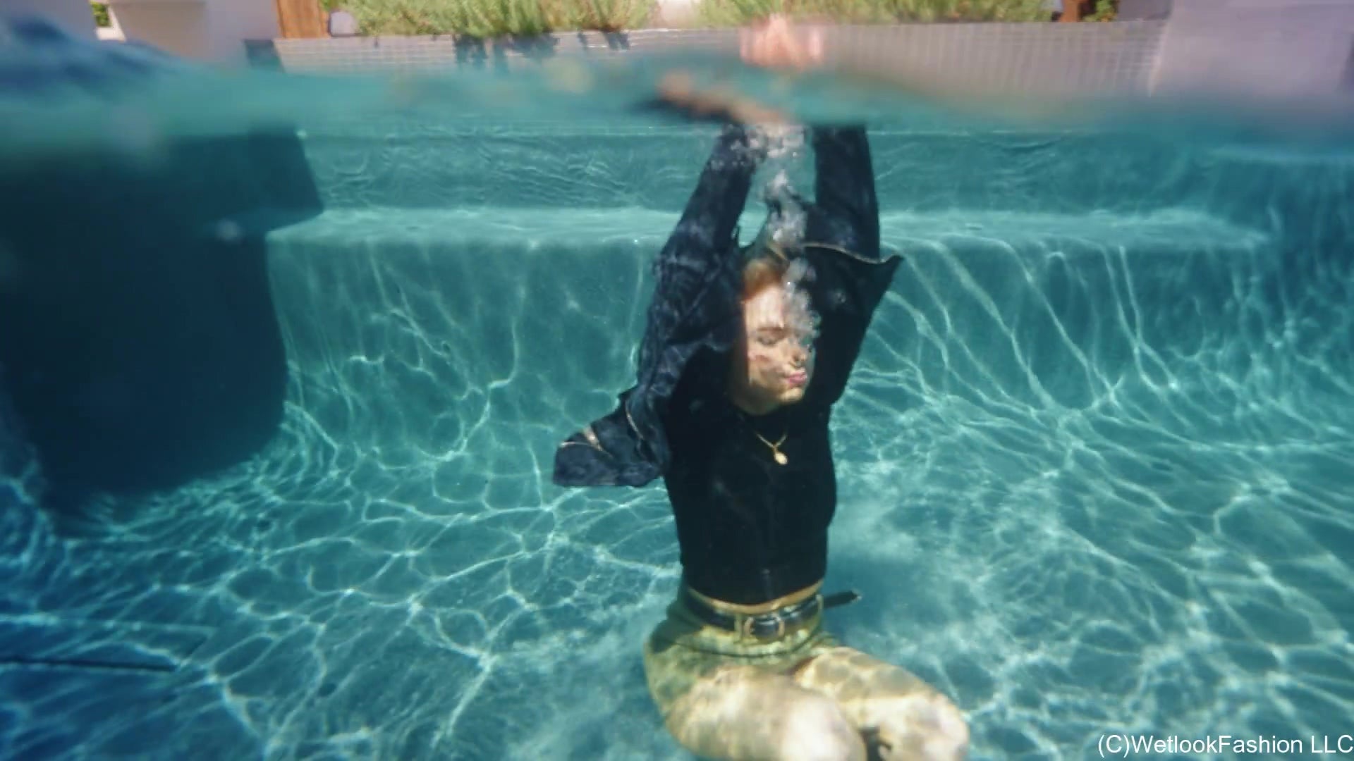 Casey Swims in a Leather Skirt, Top and Boots