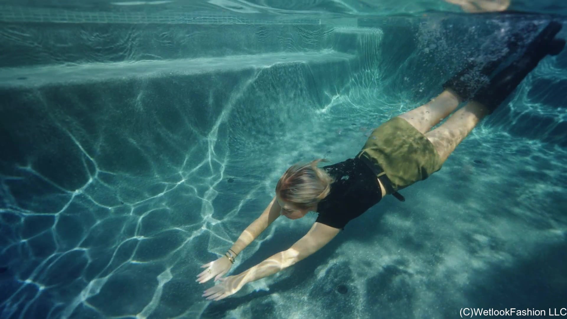 Casey Swims in a Leather Skirt, Top and Boots