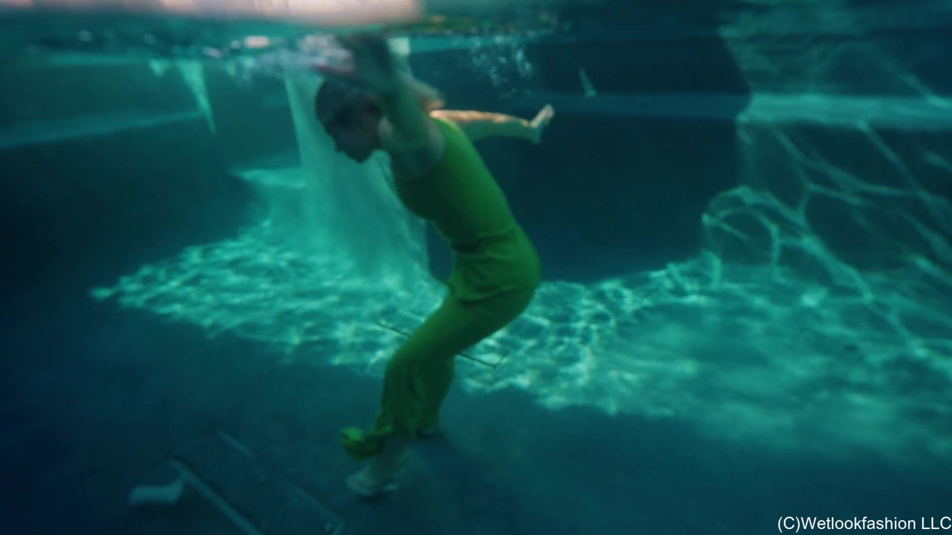 Casey Jumps in the Pool in a Green Pant Outfit