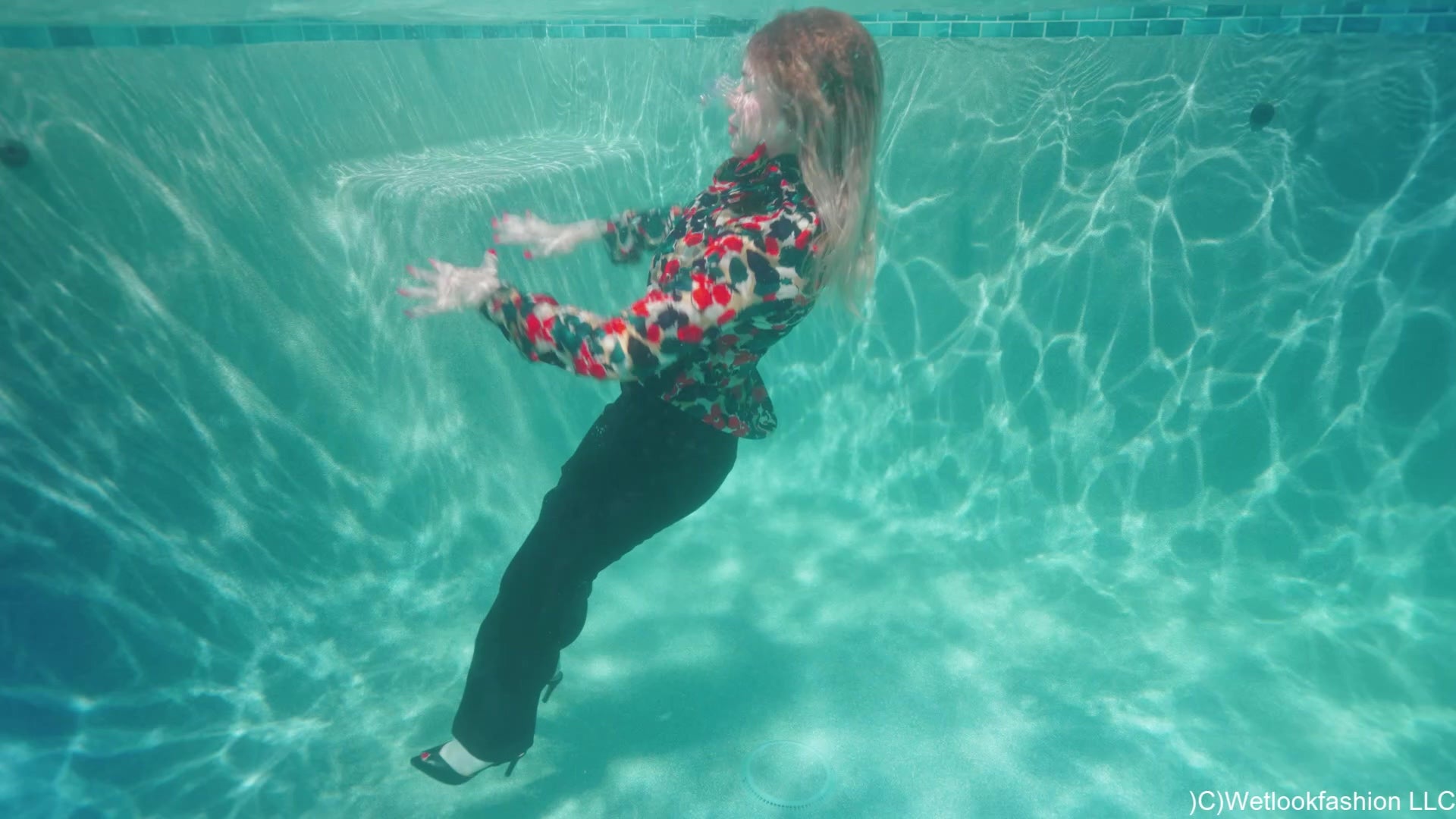 Casey Takes a Pool Dip in a Business Outfit
