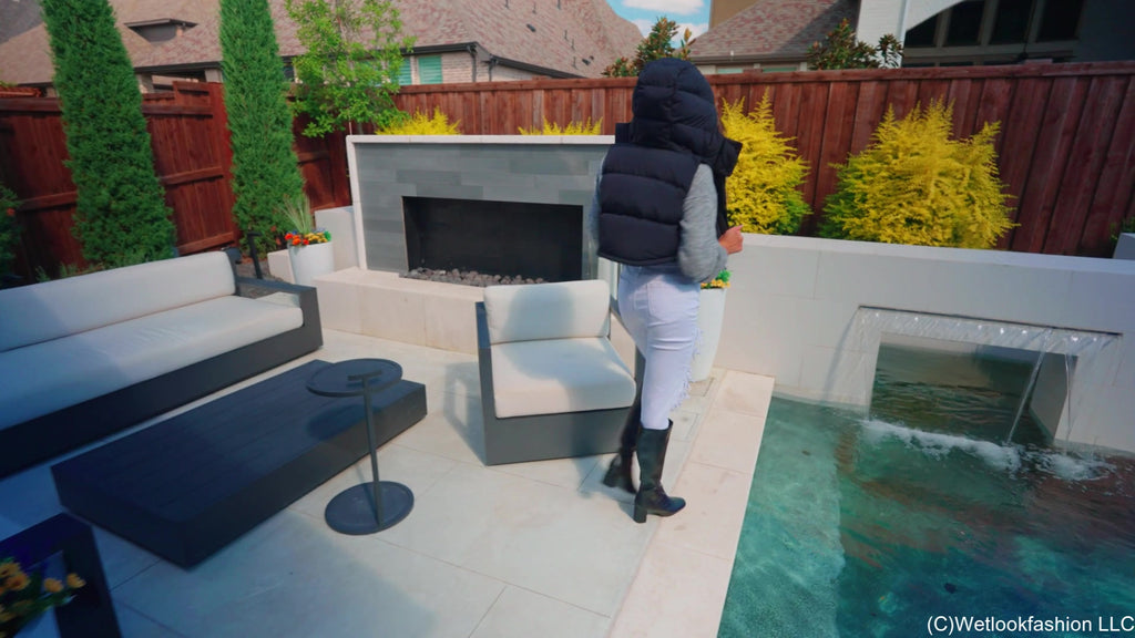 Christy Swims Wearing Jeans, Sweater, Boots and a Jacket