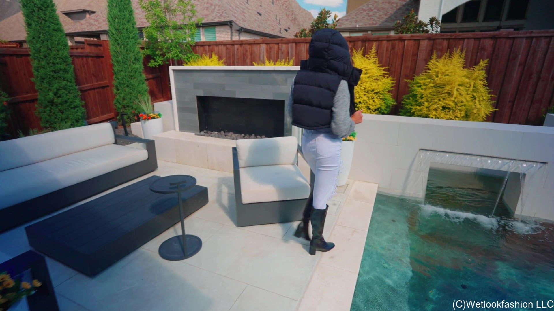 Christy Swims Wearing Jeans, Sweater, Boots and a Jacket
