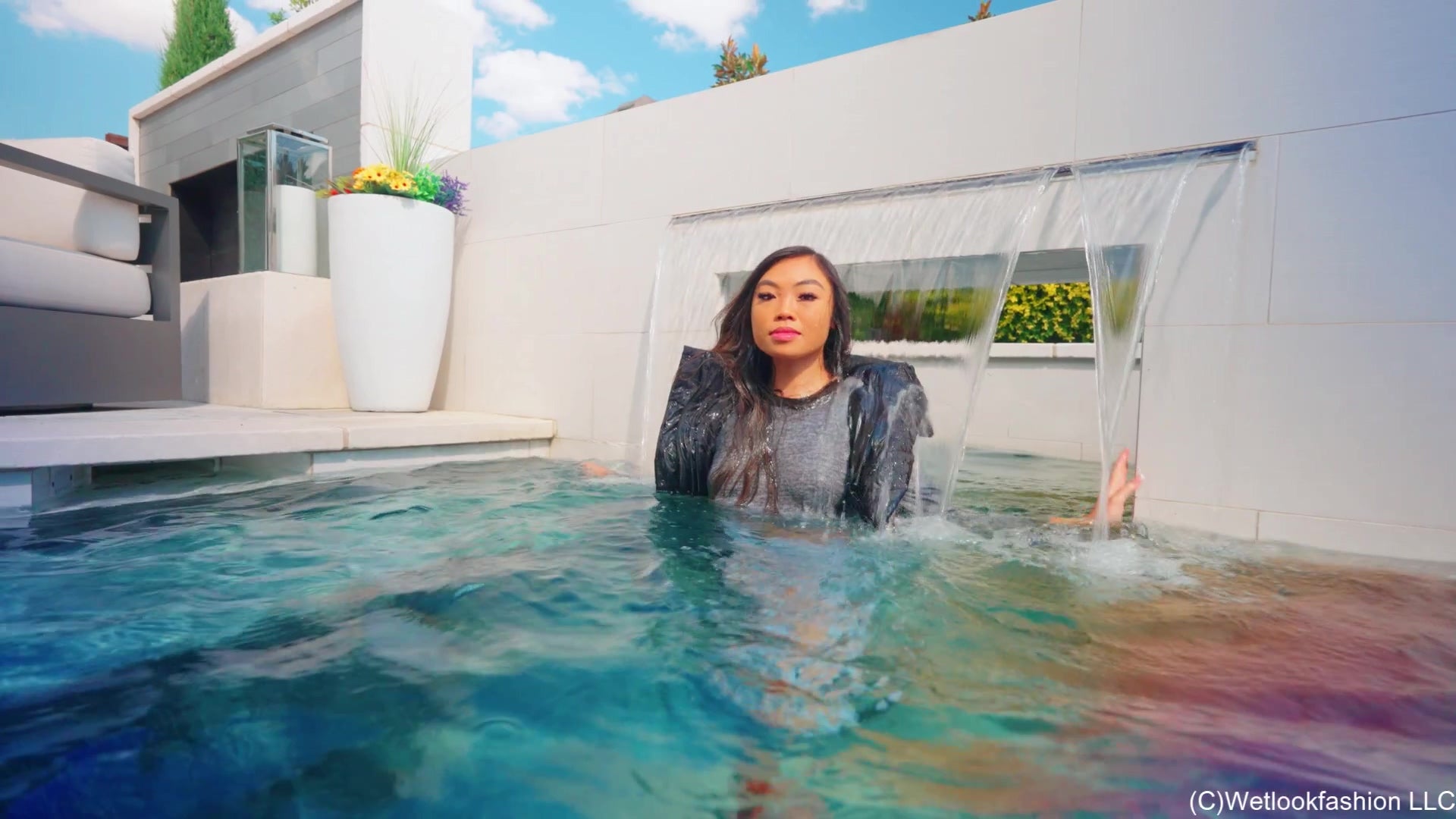 Christy Swims Wearing Jeans, Sweater, Boots and a Jacket